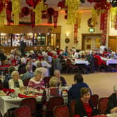People at the Irish Centre in Leeds celebrating their Christmas dinner in 2019. Picture: Tony Johnson.