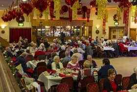 People at the Irish Centre in Leeds celebrating their Christmas dinner in 2019. Picture: Tony Johnson.