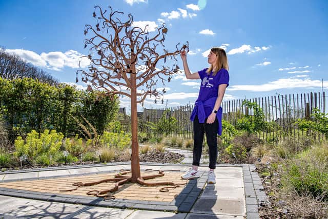 Rachel Titherington-Kay with the memory tree at the Forget Me Not children's hospice, photographed for The Yorkshire Post by Tony Johnson. The charity is hosting an open day this weekend at Russell House in Huddersfield for visitors to look around the premises.