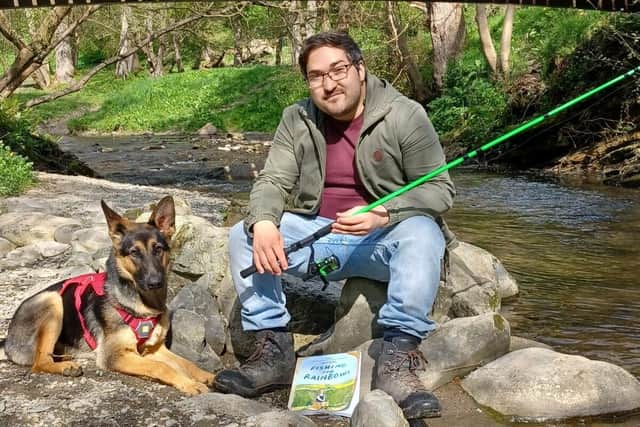 Author Oliver fishing with dog Luna