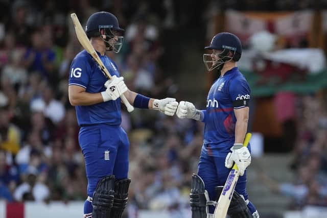 RUNS ON THE BOARD: England's batsmen Liam Livingstone and Ben Duckett  knock gloves during their partnership in the third ODI cricket match against West Indies at the Kensington Oval in Barbados Picture: Photo/Ricardo Mazalan