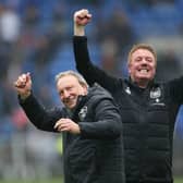 Neil Warnock and Ronnie Jepson celebrate Huddersfield Town's late-season victory at Cardiff City in the spring. Picture: PA