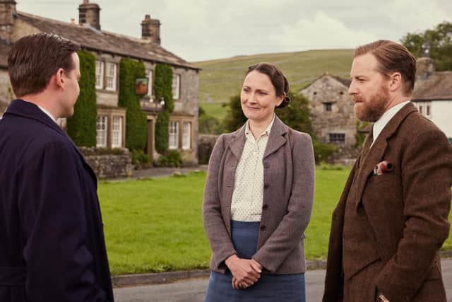 All Creatures Great And Small S4: James Herriot (Nicholas Ralph) talks with Mrs Hall (Anna Madeley) and Siegfried Farnon ( Samuel West). Helen Williams/Channel 5