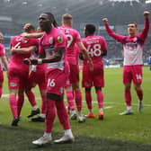 PARTY TIME: Huddersfield Town’s Matthew Pearson celebrates with team-mates after an own goal by Cardiff City’s Jack Simpson in South Wales on Sunday. Picture: Nigel French/PA