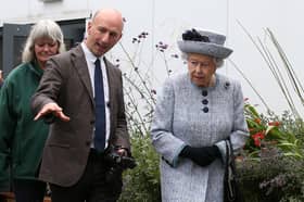 Queen Elizabeth II with Robertson Family Roof Garden designer Professor Nigel Dunnett, during a visit to Aberdeen Royal Infirmary to open the roof garden and meet patients and staff.