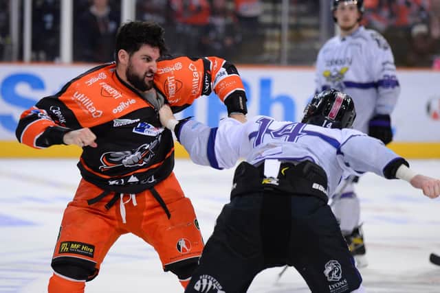 UP FOR IT: Sheffield Steelers' Brandon McNally tussles with Manchester Storm's Chays Ruddy during SUnday night's Challenge Cup encounter. Picture: Dean Woolley.
