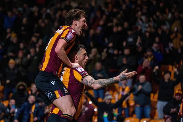Andy Cook celebrates scoring Bradford City's second goal against Tranmere Rovers with Richie Smallwood.  Picture: Bruce Rollinson