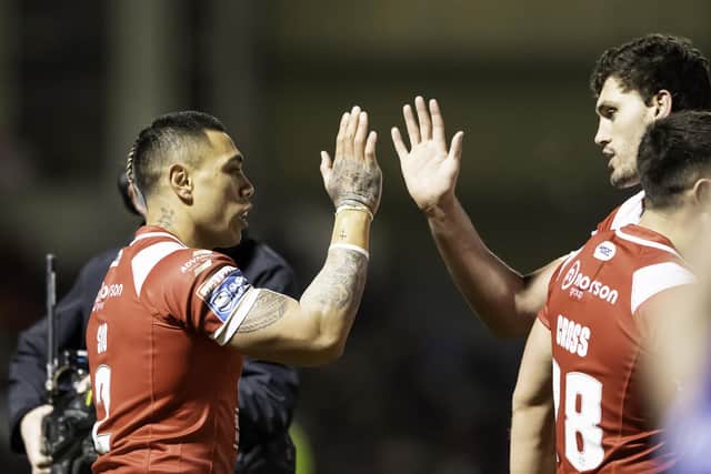 Ken Sio, left, is congratulated on scoring a try against Hull KR. (Photo: Allan McKenzie/SWpix.com)