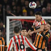 Sheffield United's Jack Robinson raises above Hull City rival Aaron Connolly during the Championship match at Bramall Lane. Picture: Gary Oakley/Sportimage