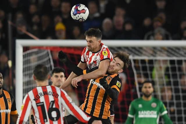 Sheffield United's Jack Robinson raises above Hull City rival Aaron Connolly during the Championship match at Bramall Lane. Picture: Gary Oakley/Sportimage