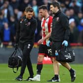 DOUBT: Sheffield United captain Jack Robinson goes off injured against Chelsea