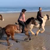 Outdoor experiences are very much encouraged at Fyling Hall and here pupils are seen riding at the beach.