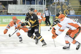 EDGED OUT: Sheffield Steelers' Jon Phillips (left) and Alex Graham battle with Nottingham's Mathieu Gagnon on Sunday at the National Ice Centre. Picture courtesy of EIHL.