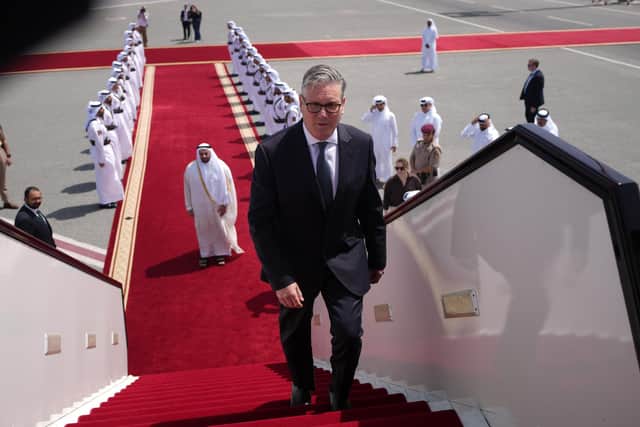 Prime Minister Sir Keir Starmer boards a plane at the airport in Doha, Qatar, following his visit to the Gulf region. PIC: Alastair Grant/PA Wire