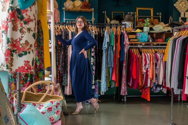 Kristen Clark, Assistant Manager at Saint Michael's Hospice Charity Shop in Harrogate, wears a designer dress from the King's Road shop's boutique collection..