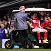 Rotherham United's Ollie Rathbone leaves the pitch on a buggy after an injury during the Sky Bet Championship match at Ipswich. Picture: John Walton/PA Wire.