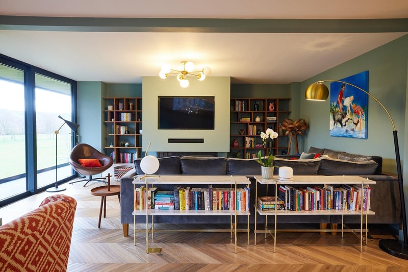 The sitting area is cosy and is full of colour reflecting the family's love of art and books