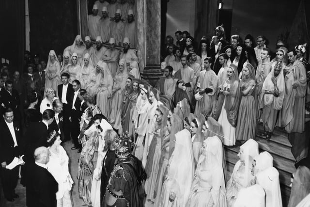 Queen Elizabeth II and Prince Philip talk to the cast after a performance of 'Samson' by the Covent Garden Opera Company, at the Grand Theatre, Leeds, circa 1952.