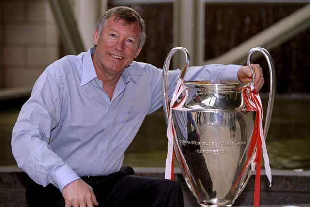 Manchester United manager Alex Ferguson shows off the European Cup on his return to Manchester after victory in the UEFA Champions League final over Bayern Munich. (Picture: Ben Radford /Allsport)