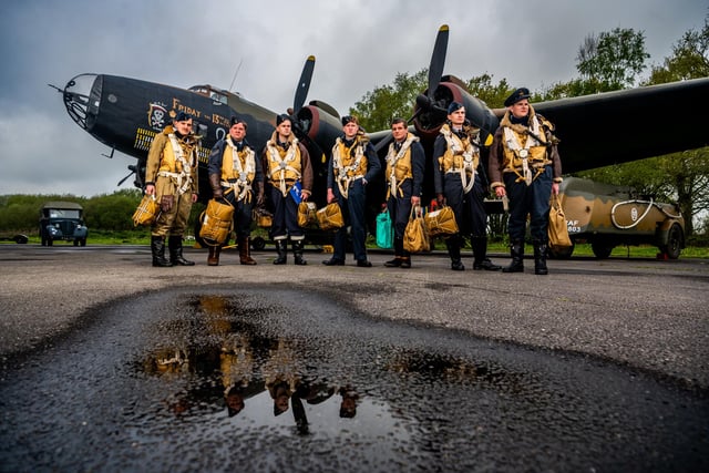 Pictured Members of Tail-End Charlies Re-Enacting group dressed as Halifax crew 77 squadron, infront of the British Royal Air Force Handley Page Halifax bomber.
Picture By Yorkshire Post Photographer,  James Hardisty