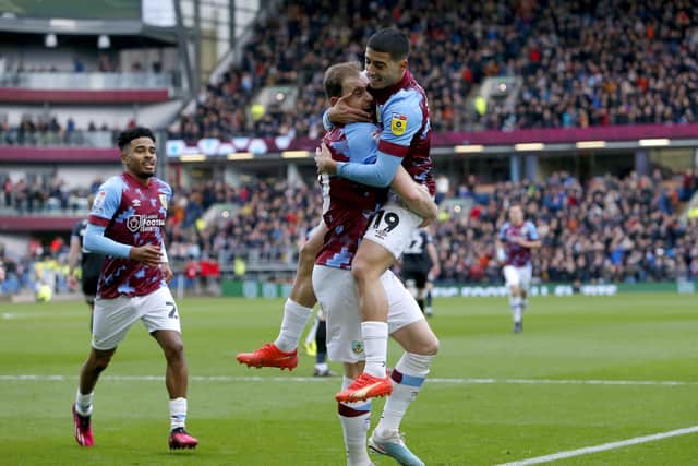 Burnley's Ashley Barnes celebrates with team-mate Anass Zaroury after scoring their side's first goal of the game during the Sky Bet Championship match at Turf Moor, Burnley. Picture: Will Matthews/PA