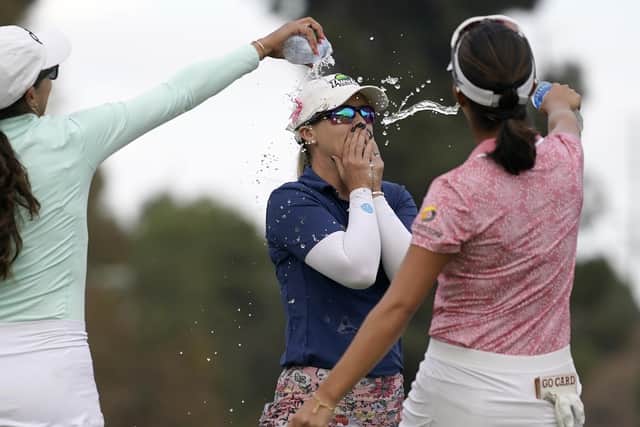 Jodi Ewart Shadoff, center, of North Yorkshire, is doused with water by Paula Reto, left, and Andrea Lee after winning for the first time on the LPGA Tour in California (AP Photo/Mark J. Terrill)