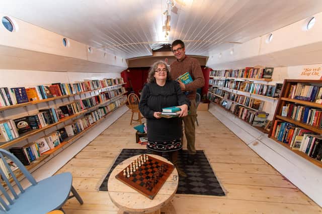 Chris and Victoria Bonner who have converted their barge Marjorie. R. into floating bookshop 'The Hold Fast Bookshop' in Leeds Dock. Picture by Bruce Rollinson.