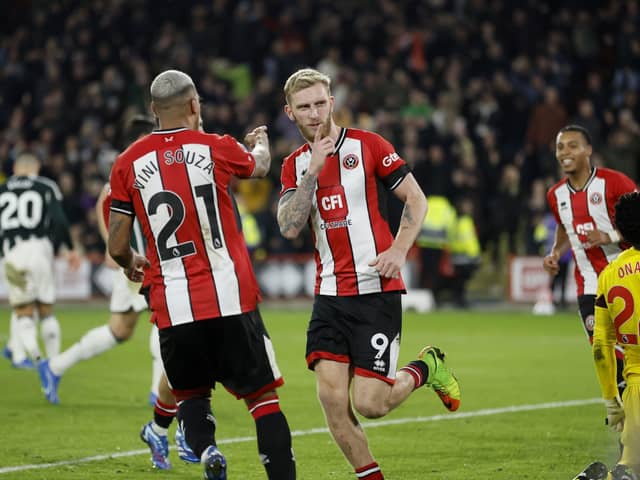 Sheffield United's Oli McBurnie (centre) celebrates after scoring from the penalty spot during the Premier League match against Manchester United at Bramall Lane, Sheffield. Picture: Richard Sellers/PA Wire.