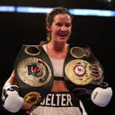NOTTINGHAM, ENGLAND - SEPTEMBER 24: Terri Harper celebrates with the WBA and IBO World Super Welterweight Title belts after defeating Hannah Rankin in the WBA and IBO World Super Welterweight title fight between Hannah Rankin and Terri Harper at Motorpoint Arena Nottingham on September 24, 2022 in Nottingham, England. (Photo by Nathan Stirk/Getty Images)