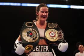 NOTTINGHAM, ENGLAND - SEPTEMBER 24: Terri Harper celebrates with the WBA and IBO World Super Welterweight Title belts after defeating Hannah Rankin in the WBA and IBO World Super Welterweight title fight between Hannah Rankin and Terri Harper at Motorpoint Arena Nottingham on September 24, 2022 in Nottingham, England. (Photo by Nathan Stirk/Getty Images)