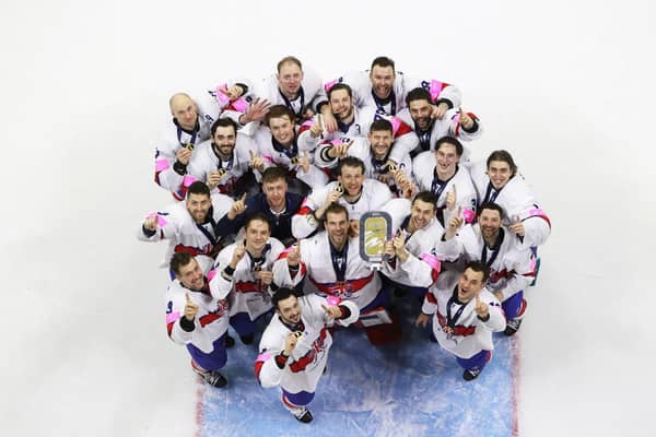 CHAMPIONS: Great Britain's players - including retiring captain Jonathan Phillips - celebrate their Division 1B gold medal in Nottingham last week. Picture courtesy of Hayley Roberts/Ice Hockey UK Media