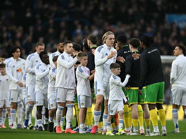 MARCHING ON: Leeds United players before the FA Cup fifth-round tie at home to Norwich City (Image: Paul ELLIS / AFP via Getty Images)