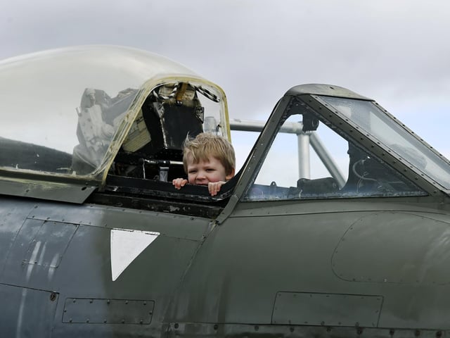 Four year old Edward Clark from Northallerton in a Meteor during the open cockpit event at the Yorkshire Air Museum, near York.