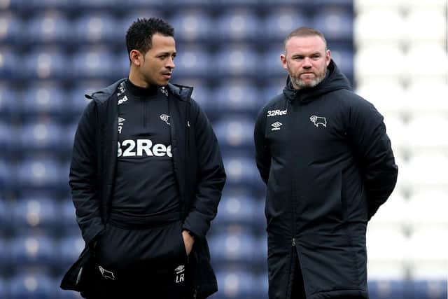 STARTING OUT: Liam Rosenior, pictured with Derby County manager Wayne Rooney (right) in April 2021. Picture: Martin Rickett/PA