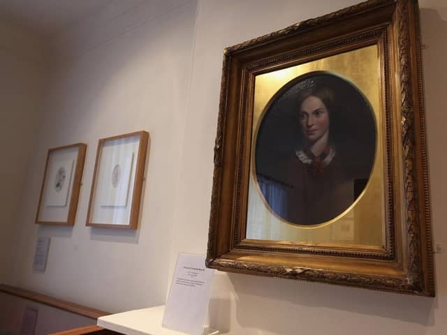 A portrait of Charlotte Bronte on display in her old bedroom at the Bronte Parsonage Museum. (Pic credit: Christopher Furlong / Getty Images)