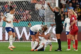 Anguish: England's midfielder Keira Walsh, bottom, reacts in pain on the ground after picking up an injury during the Lionesses 1-0 win over Denmark in the Women's World Cup in Sydney (Picture: DAVID GRAY/AFP via Getty Images)