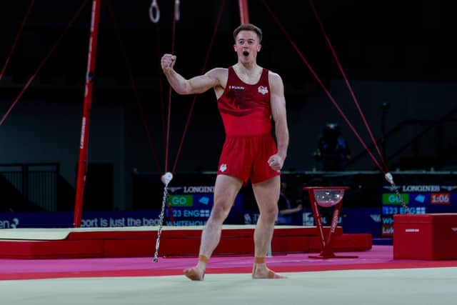 Luke Whitehouse shows his delight with his routine in the Men's Floor Exercise Final - winning gold in Glasgow. Picture: Team England/PA.