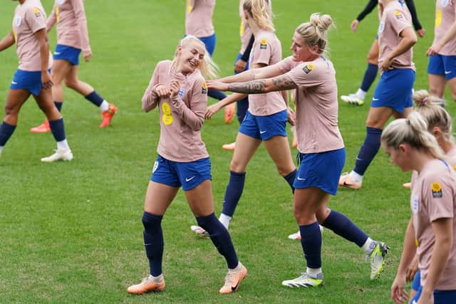 UP FOR IT: England's Chloe Kelly (left) and Millie Bright lark about during a training session at Spencer Park, Brisbane, Australia. Picture: Zac Goodwin/PA