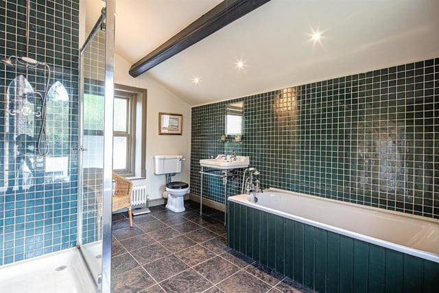 Rock House has two luxurious bathrooms, one ensuite, with period style fittings framed by elegant tiling.