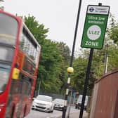 A London bus passes an information sign for the Ultra Low Emission Zone (Ulez) in London. Mayor Sadiq Khan intends to extend Ulez to all of London's boroughs. PIC: Lucy North/PA Wire