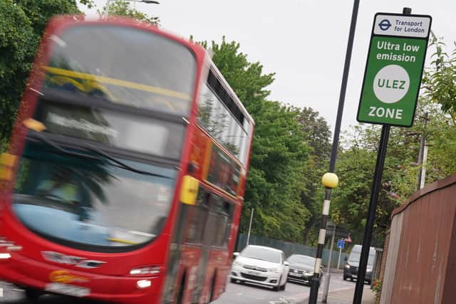 A London bus passes an information sign for the Ultra Low Emission Zone (Ulez) in London. Mayor Sadiq Khan intends to extend Ulez to all of London's boroughs. PIC: Lucy North/PA Wire