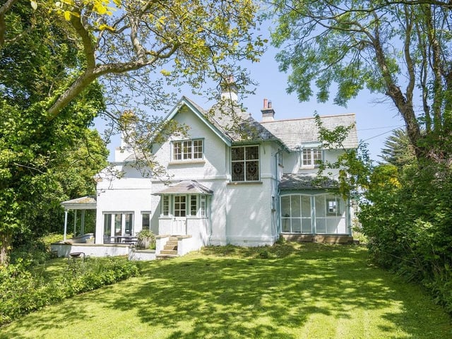 White Lodge offers a rare opportunity to buy a unique, secluded period home with vast private gardens, grounds and enchanting woodland which looks like it has come straight out of a fairytale book in a stunning coastal location.