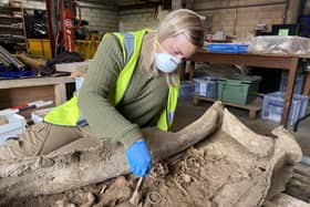 WYAS archaeologist Kylie Buxton working on the lead coffin and the Roman woman’s remains inside following the excavation on site in 2022.