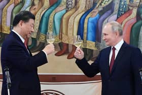 Russian President Vladimir Putin and China's President Xi Jinping make a toast during a reception following their talks at the Kremlin in Moscow on March 21, 2023. PIC: PAVEL BYRKIN/SPUTNIK/AFP via Getty Images