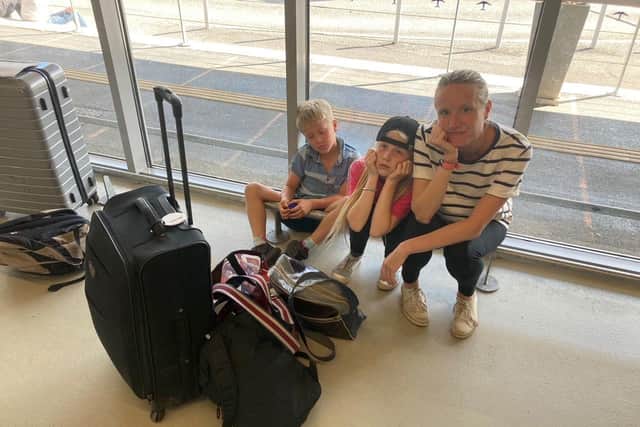 Rory Dollard's wife Joanne and their children Emily, 10, and Arthur, eight at Bergerac Dordogne Perigord Airport. Photo credit: Rory Dollard/PA Wire
