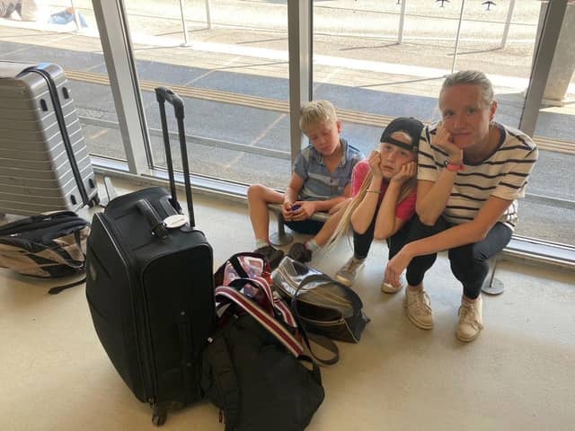 Rory Dollard's wife Joanne and their children Emily, 10, and Arthur, eight at Bergerac Dordogne Perigord Airport. Photo credit: Rory Dollard/PA Wire