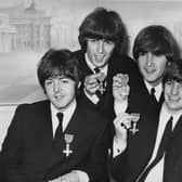 The Beatles hold a press reception at the Saville Theatre in London after each received an MBE at Buckingham Palace in October 1965. From left to right, Paul McCartney, George Harrison, John Lennon, Ringo Starr. (Photo by Central Press/Hulton Archive/Getty Images).