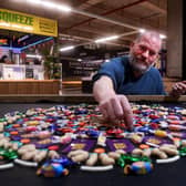 Barnsley Market celebrates its 775th Anniversary. Artist James Brunt pictured  on his work at the Market Picture taken by Yorkshire Post Photographer Simon Hulme 6th February 2024


