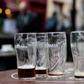 Empty pint glasses outside a bar. PIC: Brian Lawless/PA Wire