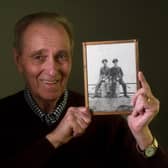 John Brown pictured with a photograph of his brother Flying Officer Walter Brown (right in the Photograph) and his friend Canadian Flying officer Lloyd Berry who were lost in a plane accident in France in World War 11, at his home at Tickhill, Doncaster